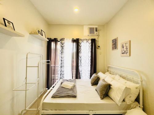 a hospital bed in a room with a window at 4BR House in Pardo Cebu Perfect for Groups in Cebu City