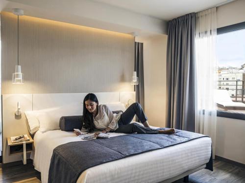 Cama o camas de una habitación en Mercure Barcelona Condor