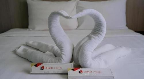 Ένα ή περισσότερα κρεβάτια σε δωμάτιο στο Kimal Hotel Taiping