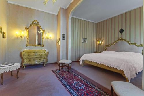 Ένα ή περισσότερα κρεβάτια σε δωμάτιο στο Ca' Maddalena