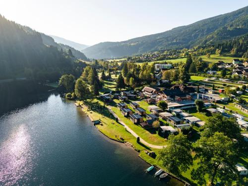 an aerial view of a village next to a river at Fischerhof Glinzner Hotel-Restaurant-Camping in Afritz