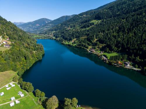 an aerial view of a lake in the mountains at Fischerhof Glinzner Hotel-Restaurant-Camping in Afritz