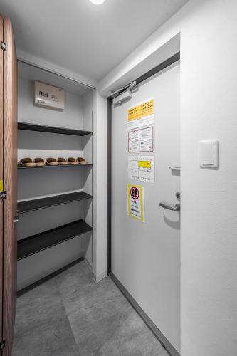 a walk in closet with a door and some donuts at SERAPHIC 千歳MS101 in Chitose