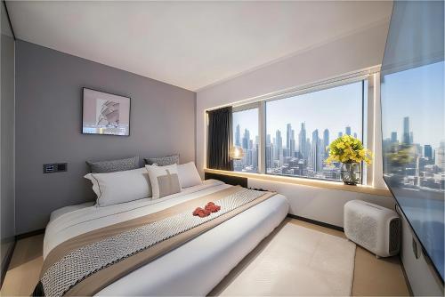 Кровать или кровати в номере Yushe International Hotel - Pazhou Convention and Exhibition Center, Haizhu District, Guangzhou - Exclusive for the Canton Fair