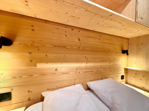 Un ou plusieurs lits dans un hébergement de l'établissement Appartement au pied des pistes