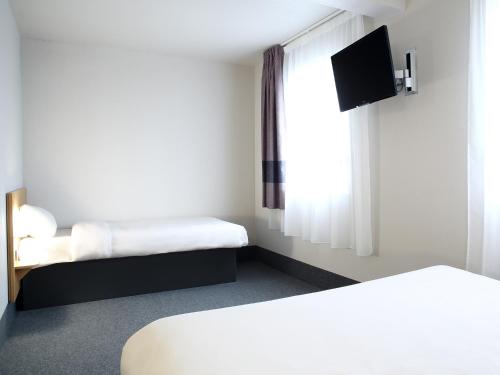 Postel nebo postele na pokoji v ubytování B&B HOTEL Perpignan Sud Marché International