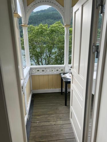 an open door to a room with a view of trees at Apartment in Stryn in Stryn