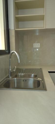 a stainless steel sink in a kitchen at Lee's Mombasa Havenstays in Kanga