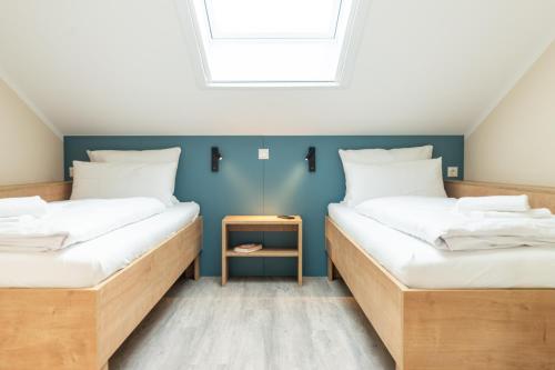 Кровать или кровати в номере Ostsee Apartmenthotel