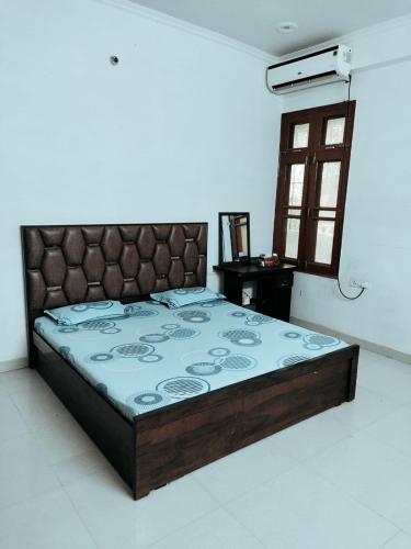 a bedroom with a bed in a room at Syno in Lucknow