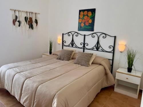 a bedroom with a large bed in a room at San Lorenzo Beach in Marina di San Lorenzo