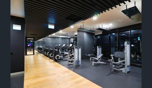 a gym with a lot of treadmills and machines at Fortitude Valley Dreamscape in Brisbane