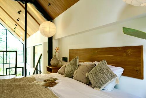 Postel nebo postele na pokoji v ubytování Ubud Dzen Villa 4