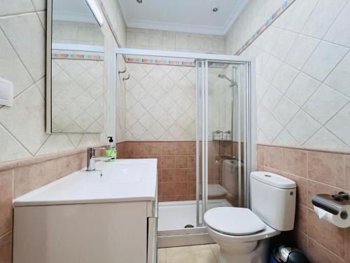 a bathroom with a toilet and a shower and a sink at Santa Barbara Tropical by Alquiler de Sueno - 2 private terraces in Playa del Ingles