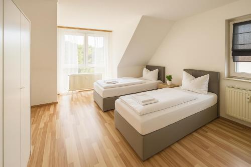 Postel nebo postele na pokoji v ubytování SUNNYHOME Monteurwohnungen und Apartments in Nittendorf