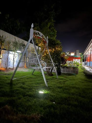 a roller coaster in a yard at night at 3P Phuket Airport Hotel in Phuket