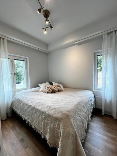 Postel nebo postele na pokoji v ubytování Uutuutta hohtava tyylikäs kolmio lähellä keskustaa