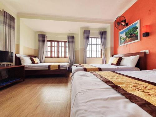 En eller flere senge i et værelse på Thái Bình Hotel Vũng Tàu