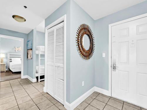 a room with blue walls and a white door at Laketown Wharf 331 in Panama City Beach