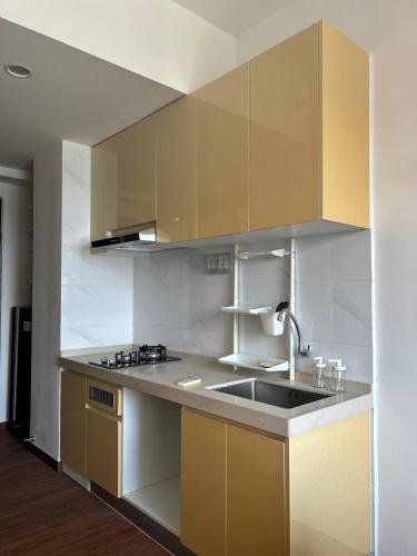 a kitchen with a sink and a counter top at Sky House Studio Apartment in CBD BSD near AEON and ICE in Cilenggang