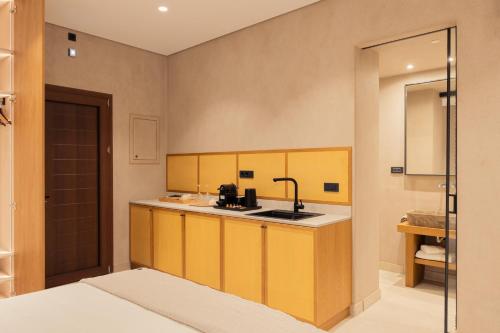 Ένα ή περισσότερα κρεβάτια σε δωμάτιο στο Beau Rivage Suites