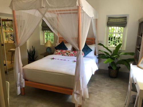 Postel nebo postele na pokoji v ubytování Lenora House, Unawatuna