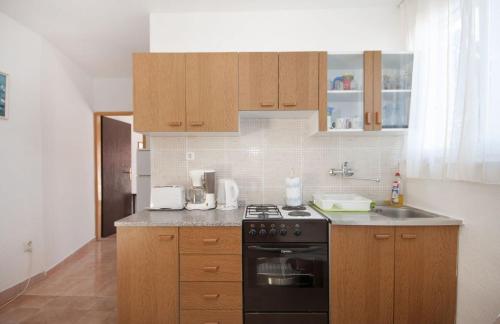 Η κουζίνα ή μικρή κουζίνα στο Apartments Mira