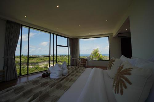 Ένα ή περισσότερα κρεβάτια σε δωμάτιο στο Villa Cliffo by Premier Hospitality Asia