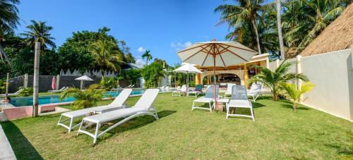 A patio or other outdoor area at Le Divine Comedie Beach Resort