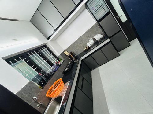 an overhead view of a kitchen with a chair at Licence To Chill Homestay Villa in Pūvār