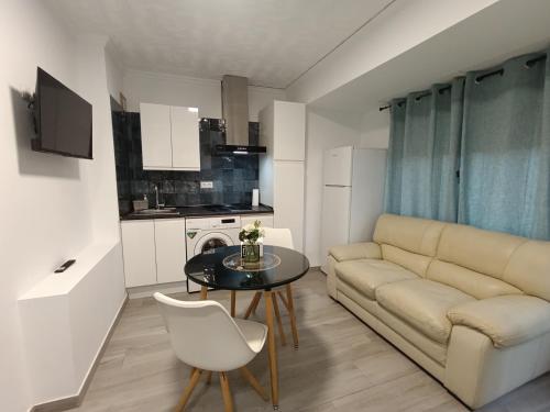 a living room with a couch and a table at ESTUDIO Villarreal in Villareal