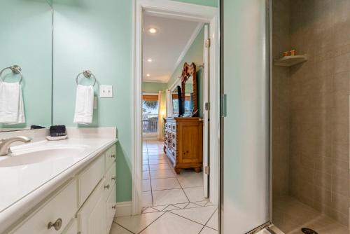 a bathroom with a sink and a shower at Cape Palms in Port Saint Joe