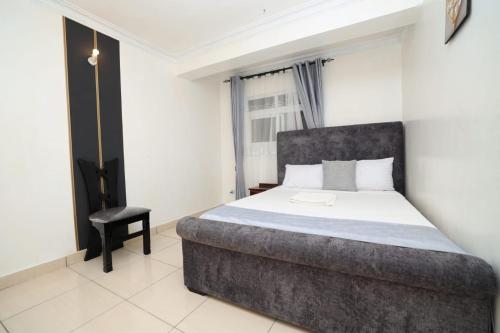 Ένα ή περισσότερα κρεβάτια σε δωμάτιο στο Sabu Apartments