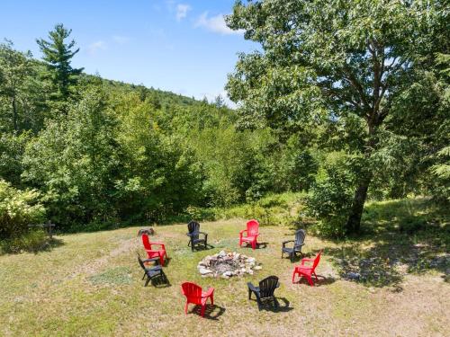 a group of chairs sitting around a fire pit at 70 Private Acres-Sleeps 12-Fire Pit-Pet Friendly in Conway