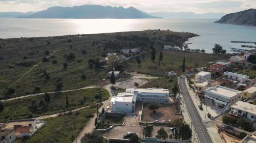 an aerial view of a small town next to the water at Perdika Residences in Perdika