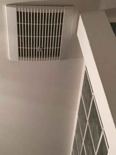 a white ceiling with a window in a building at B&B Quintino Sella in Iglesias