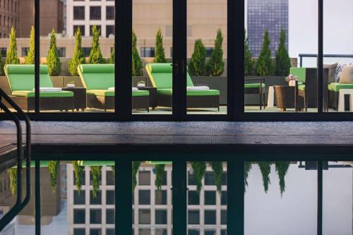 a room with chairs and a reflection in the water at The Royal Sonesta Chicago River North in Chicago