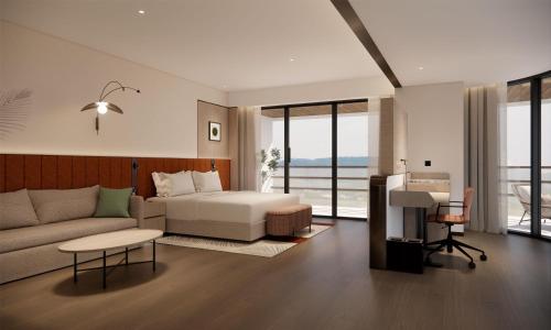 Postel nebo postele na pokoji v ubytování Hilton Garden Inn Xishuangbanna Gasa Airport