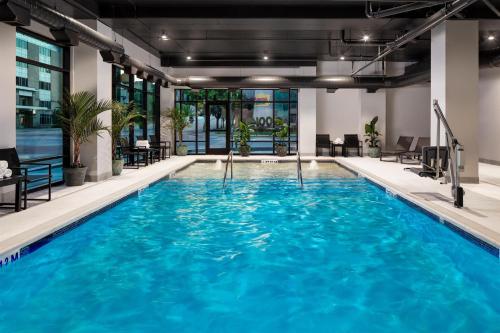 a large pool with blue water in a building at Embassy Suites By Hilton Chattanooga Downtown in Chattanooga