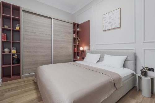 Ένα ή περισσότερα κρεβάτια σε δωμάτιο στο Atelier Boulevard