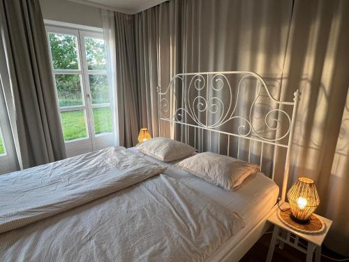 a bed with a metal headboard in a bedroom at The Garden Studio in Sankt Ruprecht an der Raab