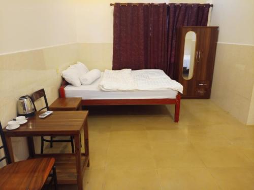 Ένα ή περισσότερα κρεβάτια σε δωμάτιο στο Blue Moon Hotel