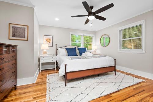 a bedroom with a bed and a ceiling fan at 1910 Asheville Gem in Fairview