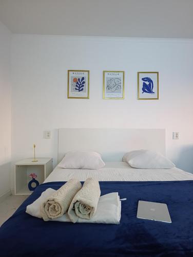 a bedroom with a bed with towels on it at Shugyla 1 Room in Kooperator