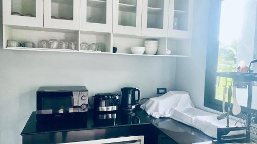 Η κουζίνα ή μικρή κουζίνα στο Natnicha Pool Villa Hatyai