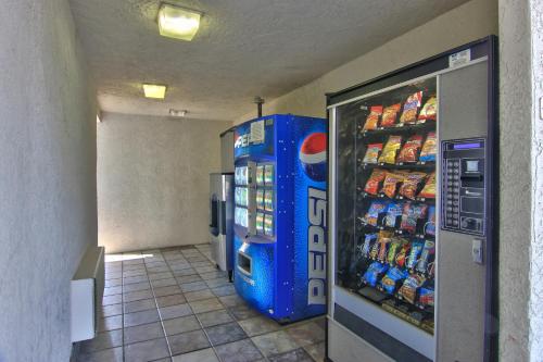 a vending machine in a store with drinks in it at Motel 6-West Sacramento, CA in West Sacramento