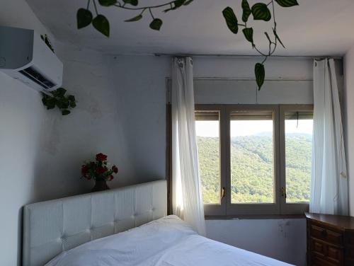 Ένα ή περισσότερα κρεβάτια σε δωμάτιο στο habitacion a 15 min playa d aro