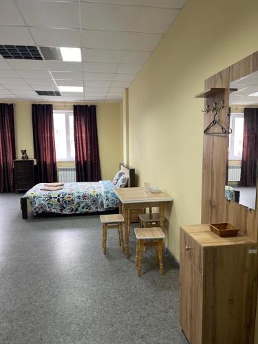a room with a bed and a desk with a desk at Hotel HEADWAY in Kyiv
