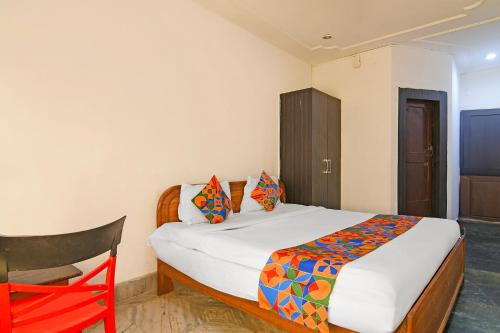 Кровать или кровати в номере FabHotel Sai Sagar Residency