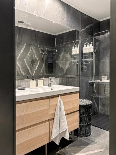 a bathroom with a sink and a shower at Villa Wisteria in Funchal